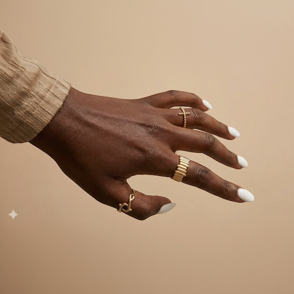 Majoa REMPART gold-tone steel ring with a segmented, architectural design. Unisex.