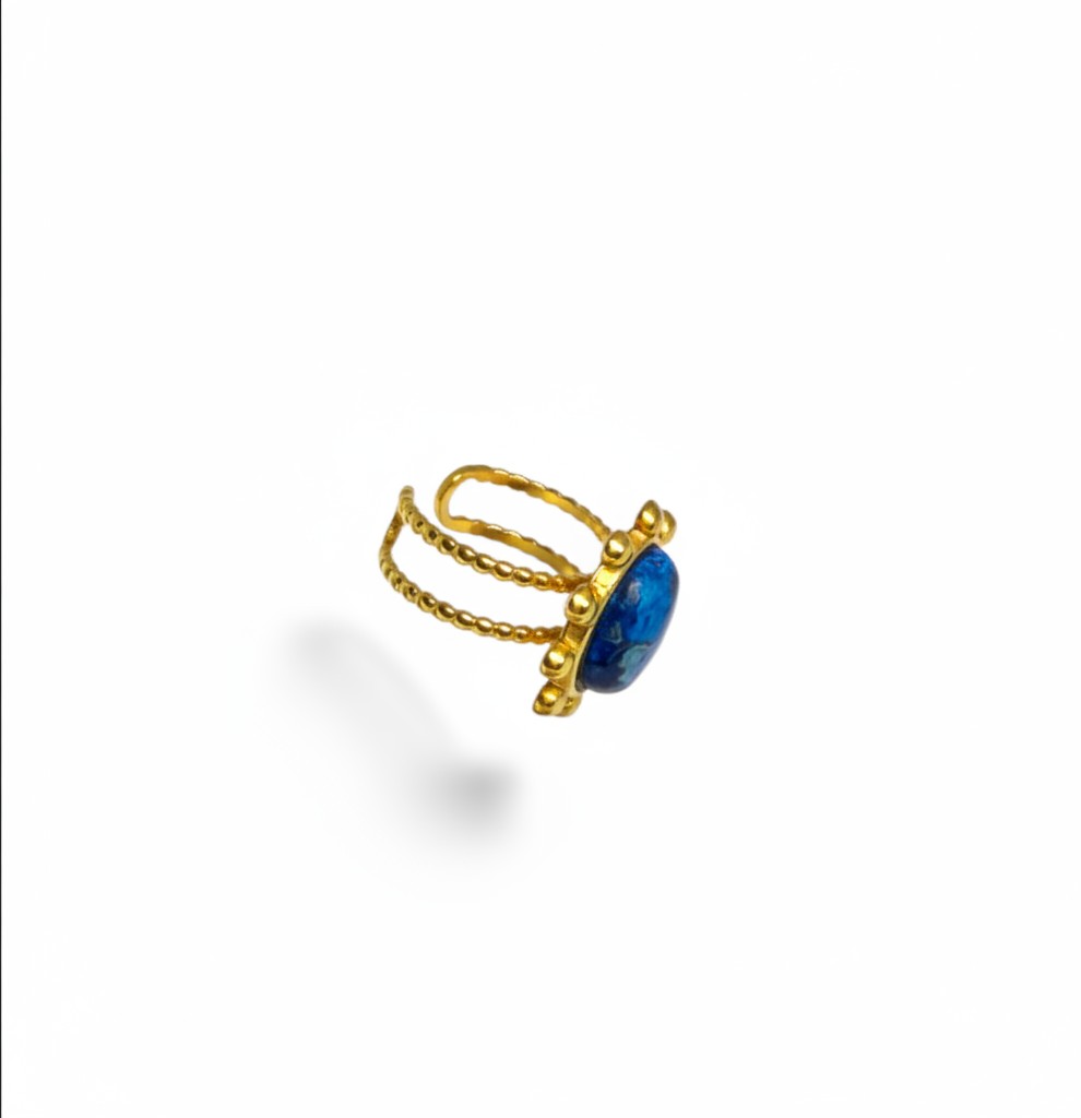 Bague ajustable Majoa Azura en acier inoxydable doré avec une pierre bleue ronde et un anneau texturé