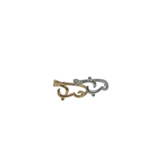 Majoa gold and silver calligraphy rings spelling 'amour' with an open design. Modern, symbolic jewelry.
