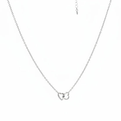 Majoa gold interlocking hearts necklace. Minimalist, elegant, and water-resistant.