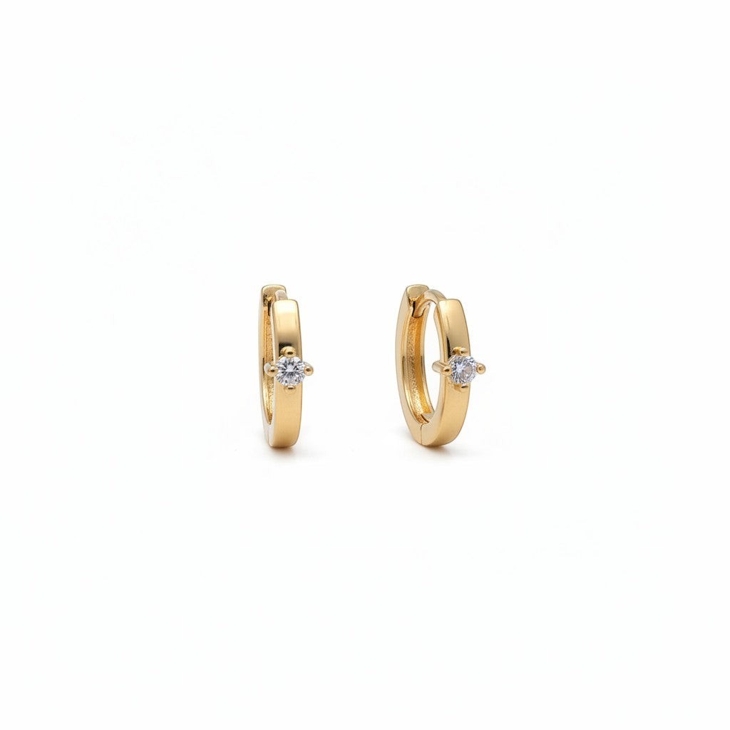 Majoa gold mini hoop earrings with a single clear stone accent. Elegant, minimalist design.