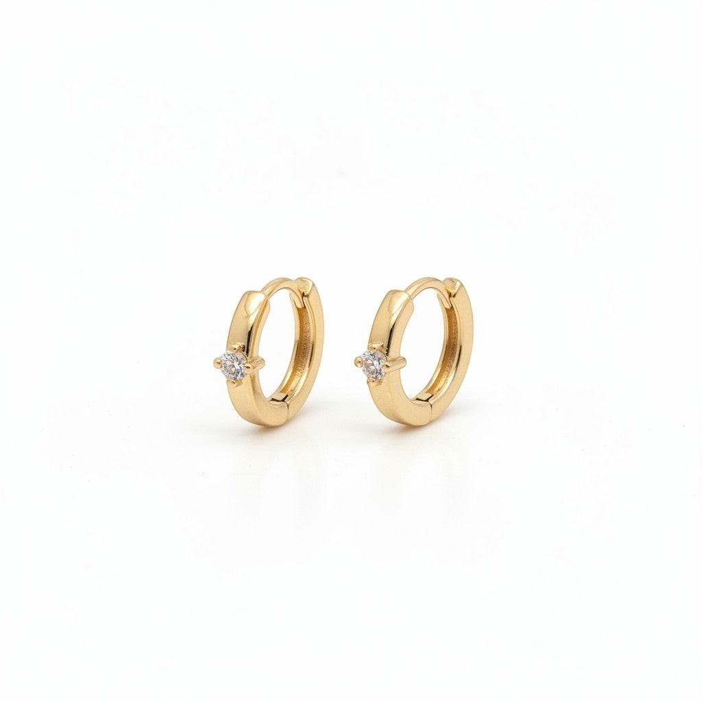 Majoa gold mini hoop earrings with a small clear stone accent. Elegant, minimalist design.