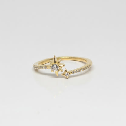 Majoa gold-tone adjustable ring with star motif and clear stones, made of 925 silver.