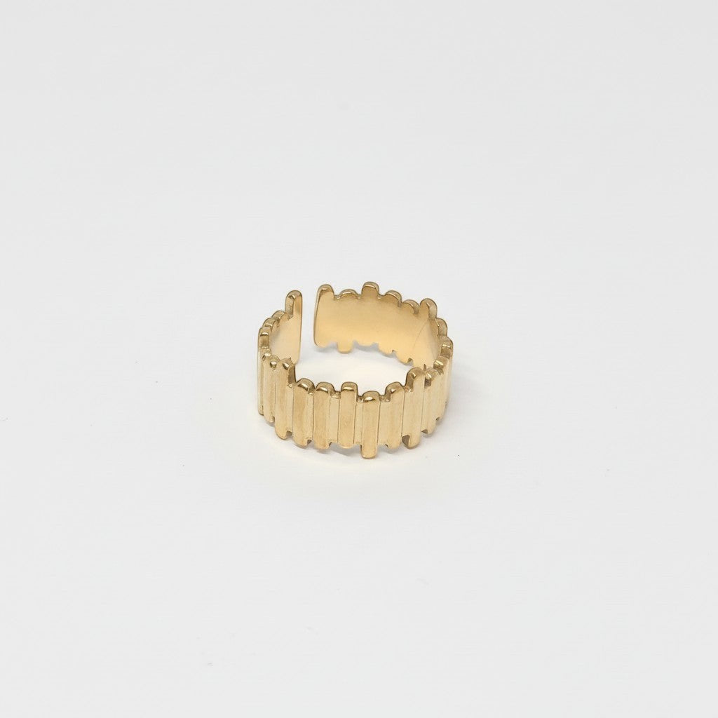 Majoa gold-tone stainless steel ring with a segmented, architectural design. Unisex.