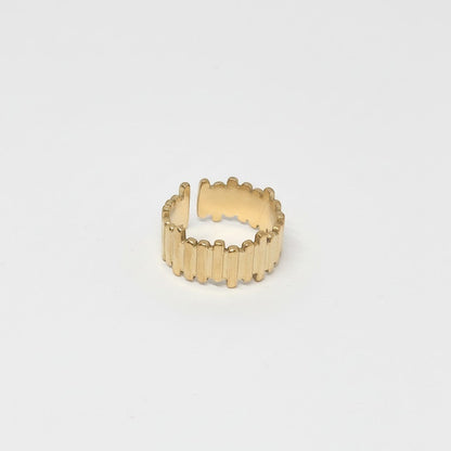 Majoa gold-tone stainless steel ring with a segmented, architectural design. Unisex.